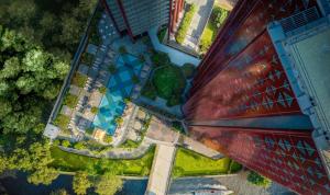 an overhead view of a building with a swimming pool at Chatrium Grand Bangkok in Bangkok