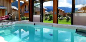 a swimming pool with a view of the mountains at Kreischberg Chalet in Murau in Murau