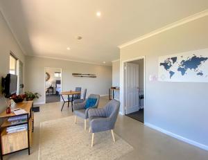 a living room with chairs and a table at Bremer Bay B&B in Bremer Bay