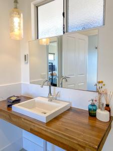 a bathroom with a white sink and a mirror at Bremer Bay B&B in Bremer Bay