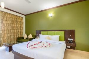 Voodi või voodid majutusasutuse Revathi Resorts toas