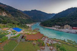 an aerial view of a resort next to a river at Aloha On The Ganges by Leisure Hotels in Rishīkesh