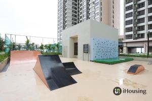 a building with a skateboard ramp in front of some buildings at Bali Residence Malacca Premium By I Housing in Melaka
