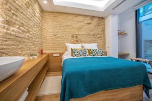 Posteľ alebo postele v izbe v ubytovaní Olivia Suites Apartments