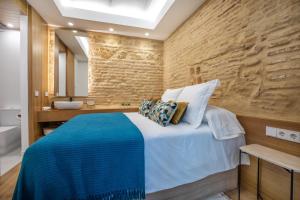 Posteľ alebo postele v izbe v ubytovaní Olivia Suites Apartments