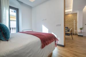 Posteľ alebo postele v izbe v ubytovaní Olivia Suites Apartments