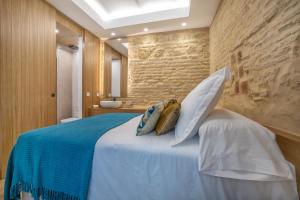 Posteľ alebo postele v izbe v ubytovaní Olivia Suites Apartments