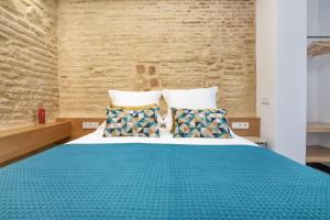 Posteľ alebo postele v izbe v ubytovaní Olivia Suites Apartments