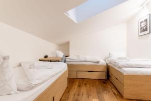 Posteľ alebo postele v izbe v ubytovaní Apartmány Resort Vrchlabí