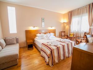 Postel nebo postele na pokoji v ubytování Hotel Petrovac