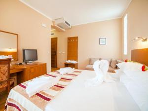 Postel nebo postele na pokoji v ubytování Hotel Petrovac