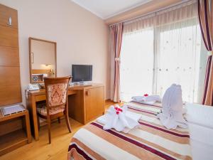 Postel nebo postele na pokoji v ubytování Hotel Petrovac