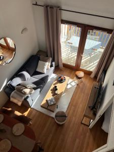 Televízia a/alebo spoločenská miestnosť v ubytovaní La Mongie magnifique Appart 7 pers vue pistes, piscine, wifi, salle de sport