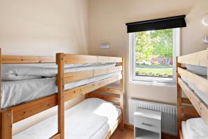 Säng eller sängar i ett rum på First Camp Gränna - Vättern
