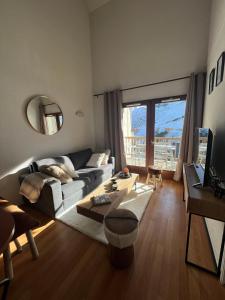 Televízia a/alebo spoločenská miestnosť v ubytovaní La Mongie magnifique Appart 7 pers vue pistes, piscine, wifi, salle de sport