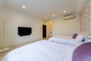 Postel nebo postele na pokoji v ubytování Romatic Venice Homestay