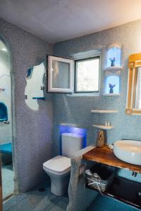 a bathroom with a toilet and a sink at Villa Christa in Arillas