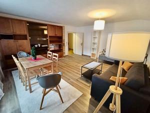 a living room with a couch and a table at Haus Maria in Bruck an der Großglocknerstraße