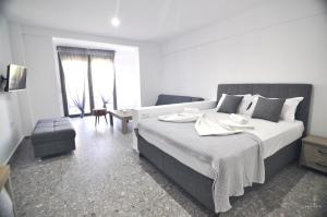 Posteľ alebo postele v izbe v ubytovaní Zennova Sirene Luxury Studios
