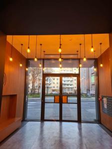 an entrance to a building with lights hanging from the ceiling at Copper Apartment Free Parking in Wrocław