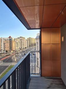 a balcony with a view of a city street at Copper Apartment Free Parking in Wrocław