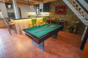 a pool table in a room with a bar at Balay Greenika Tagyatay Private Pool in Tagaytay