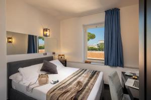 Postel nebo postele na pokoji v ubytování Fragrance Hotel St. Peter