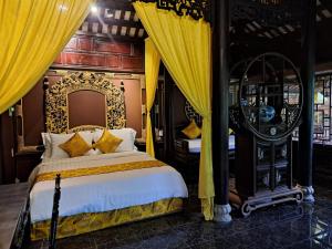 Ένα ή περισσότερα κρεβάτια σε δωμάτιο στο Mandarin Homestay Hue