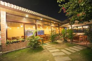 a building with a restaurant with tables and plants at Lavie Residence and Spa in Kathmandu