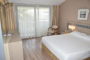 Postel nebo postele na pokoji v ubytování Pam Thermal Hotel Clinic & Spa