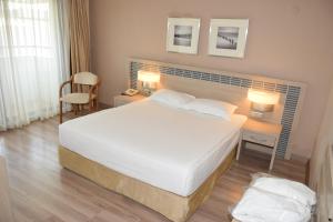Postel nebo postele na pokoji v ubytování Pam Thermal Hotel Clinic & Spa