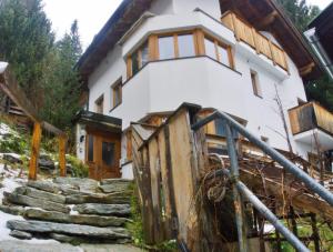 a house with stairs leading up to it at Appartement Davis-Birkl in Sankt Anton am Arlberg