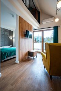 Postel nebo postele na pokoji v ubytování Rajskie Uroczysko Apartamenty Jacuzzi Sauna