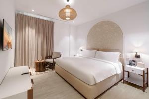 Postelja oz. postelje v sobi nastanitve Mina Hotel and Residences By The Torch + 37 fotografij