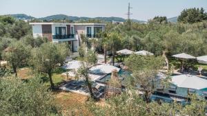 an aerial view of a resort with a pool and trees at Giardino Lux Apartments in Ulcinj