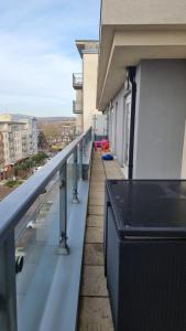 a balcony of a building with a view of a city at Beautiful and modern Apartment in North London in Hendon