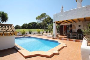 an image of a swimming pool in a villa at Ibiza style villa first line to golf! in Villamartin