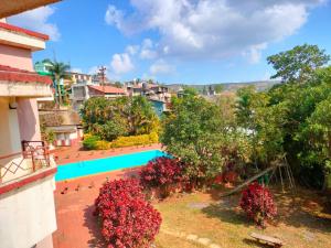 a view of a resort with a swimming pool at The Dhanhills - a valley view hotel in panchgani in Panchgani