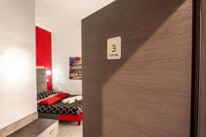 a door with the number three on it in a bedroom at Le Terrazze di San Giovanni in Rome