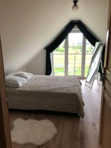 Posteľ alebo postele v izbe v ubytovaní Apartamenty Perła Orawy