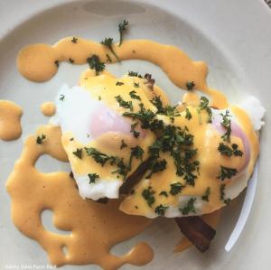 a plate of food with eggs in a sauce at Valley View Farm, Bed and Breakfast in Batcombe