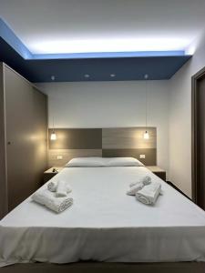 A bed or beds in a room at Notti Magiche