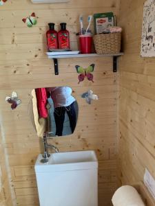 a bathroom with a toilet in a wooden wall at Captivating 1-Bed Cabin in Middlesbrough in Middlesbrough