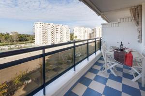 a balcony with a table and a view of buildings at Alejandrita in Playa de Gandia
