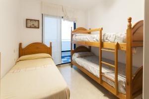 A bed or beds in a room at Alejandrita