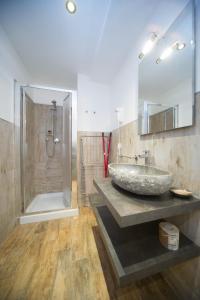 a bathroom with a sink and a shower at Residence Tabor in Bardonecchia