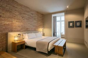 Ένα ή περισσότερα κρεβάτια σε δωμάτιο στο Colectia Stays Pau Claris