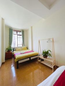 Postel nebo postele na pokoji v ubytování Homestay VICTORY