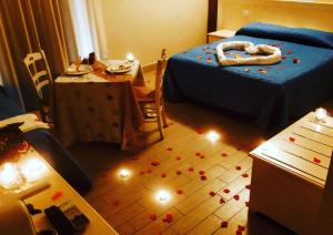 Ένα ή περισσότερα κρεβάτια σε δωμάτιο στο Hotel Al Rustico