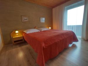Postelja oz. postelje v sobi nastanitve Seeblick-Appartements Ossiach